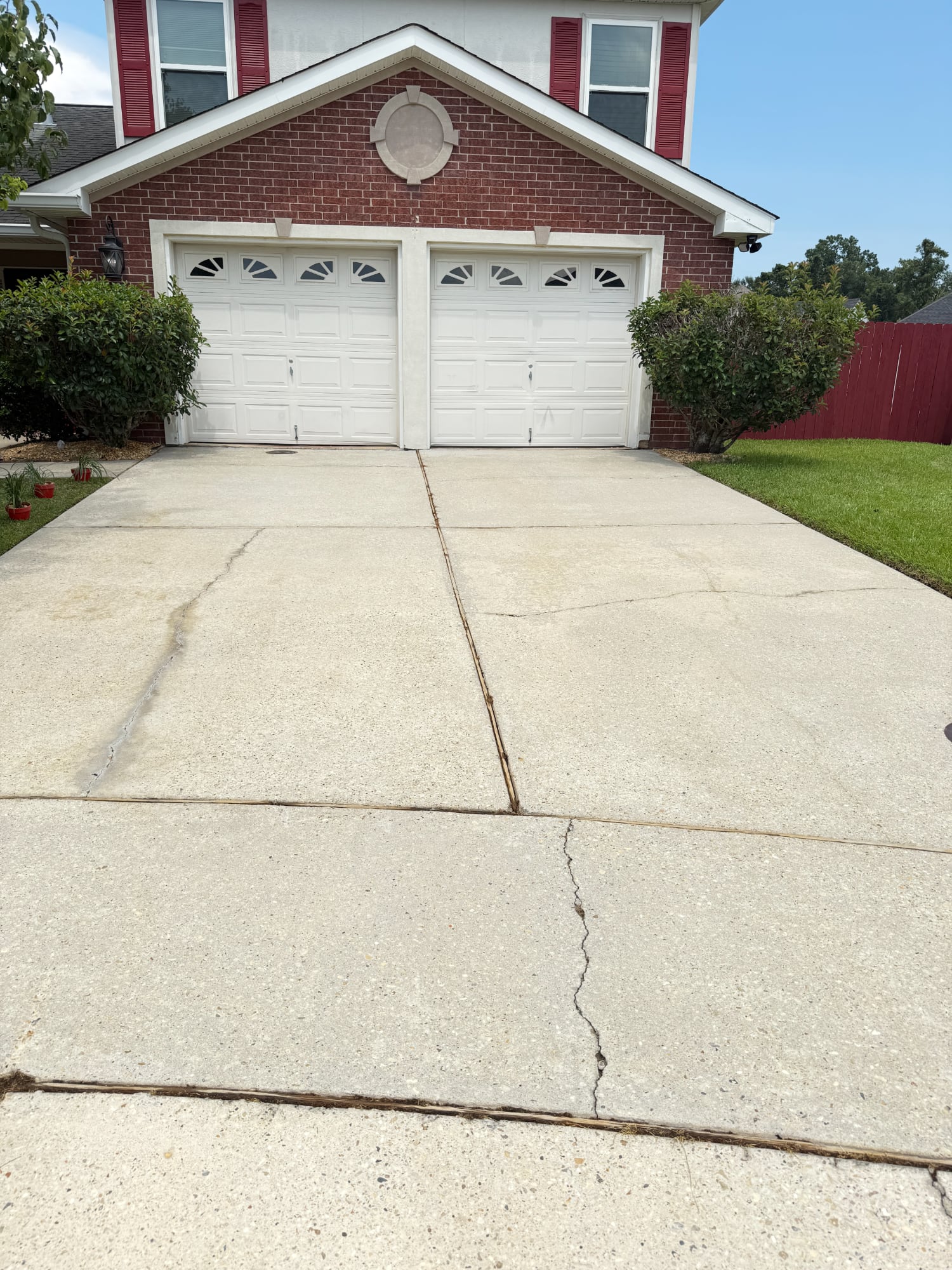 Bright, clean concrete driveway after expert pressure washing by Love Bug Pressure Washing in Metairie, LA.